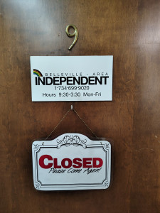 Belleville Independent's "Closed, Please Come Again" sign
